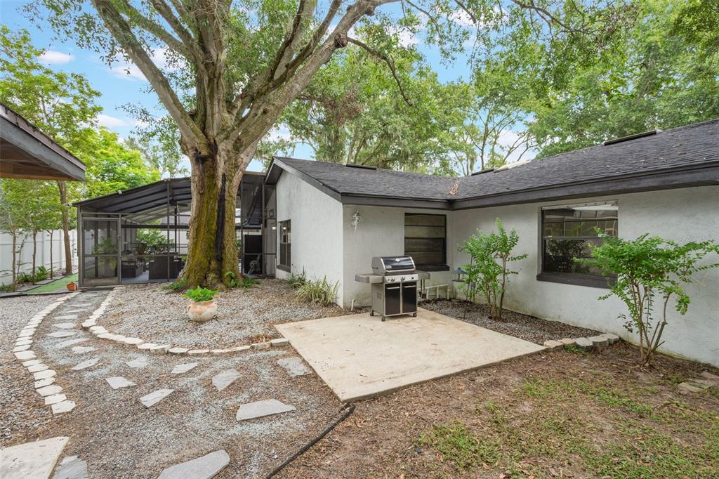 1760 12th Street Clermont, FL 34711 - Photo 40 of 42 a wooden bench sitting in front of a house