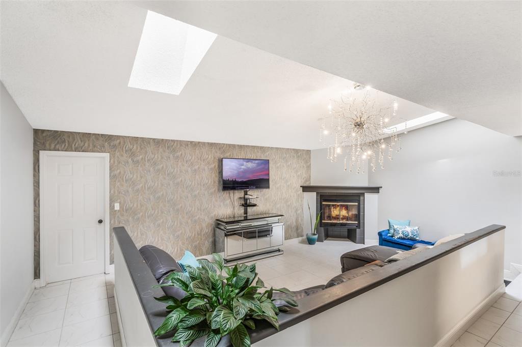 1760 12th Street Clermont, FL 34711 - Photo 6 of 42 a living room with furniture and a fireplace