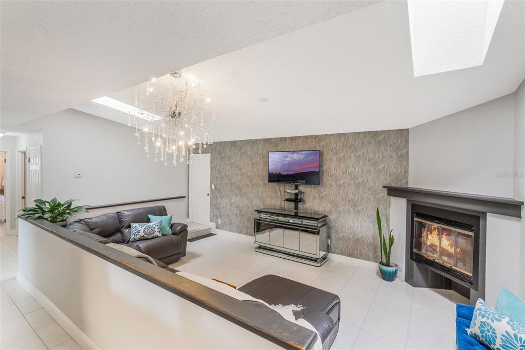 1760 12th Street Clermont, FL 34711 - Photo 7 of 42 a living room with furniture and a fireplace