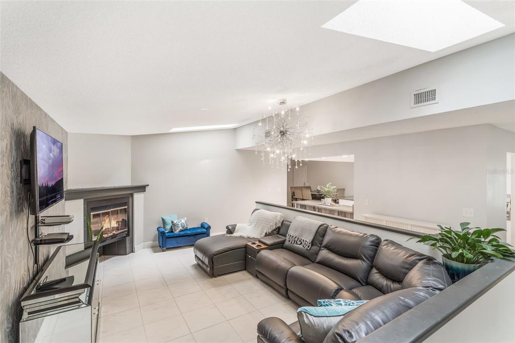 1760 12th Street Clermont, FL 34711 - Photo 9 of 42 a living room with furniture and a flat screen tv