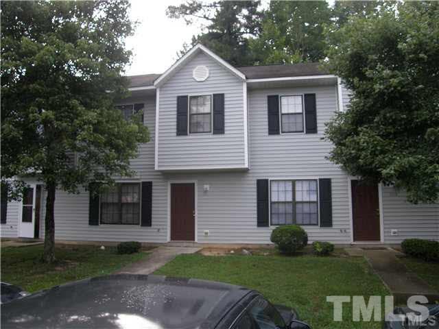 8107 Farmlea Circle Raleigh, NC 27616 - Photo 1 of 6 a front view of a house with a garden and yard