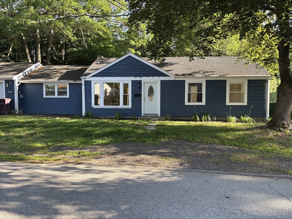 215 Jaffrey Street, Unit 1 Weymouth, MA 02188 - Photo 1 of 8 a front view of a house with a garden