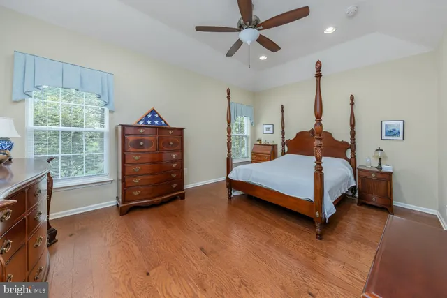 a bedroom with a bed closet and a window