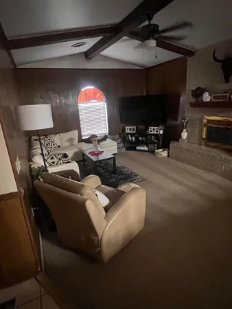 a living room with furniture and windows