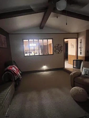 a outdoor kitchen with a stove a sink and a refrigerator