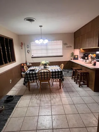 a kitchen with a sink and a stove top oven