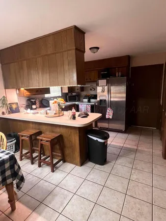a kitchen with a sink cabinets and appliances