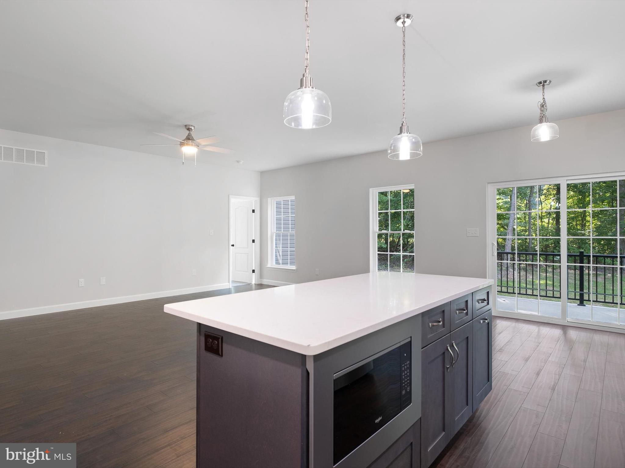 154 Pine Tree Road Townsend, DE 19734 - Photo 16 of 33 a kitchen with a stove and a chandelier