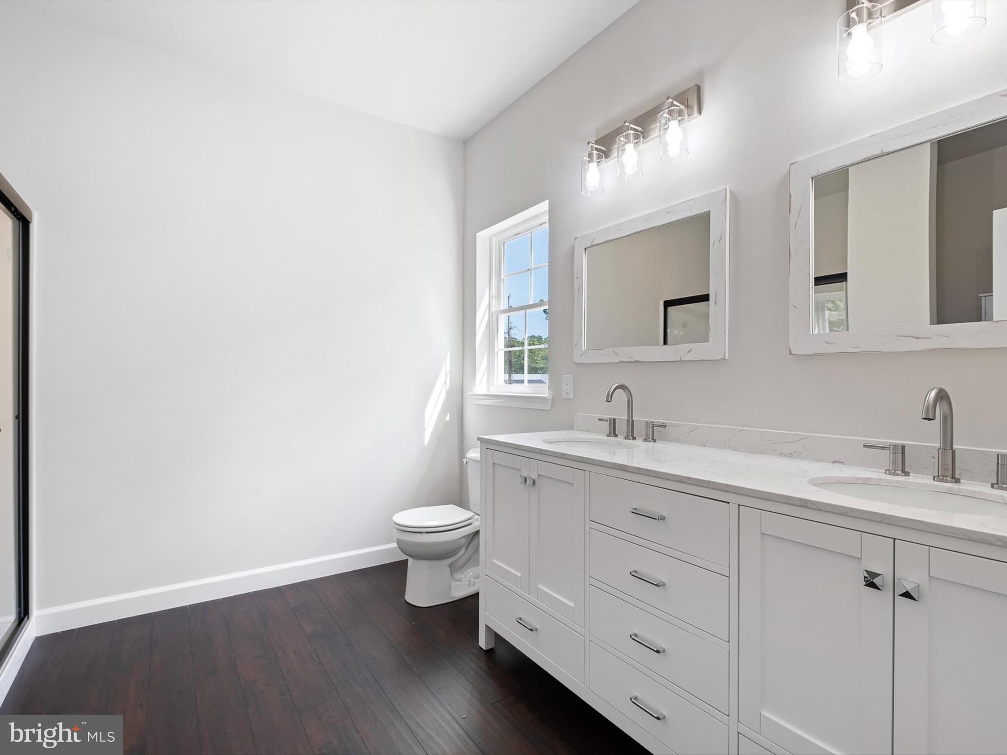 154 Pine Tree Road Townsend, DE 19734 - Photo 24 of 33 a bathroom with a granite countertop toilet sink and mirror