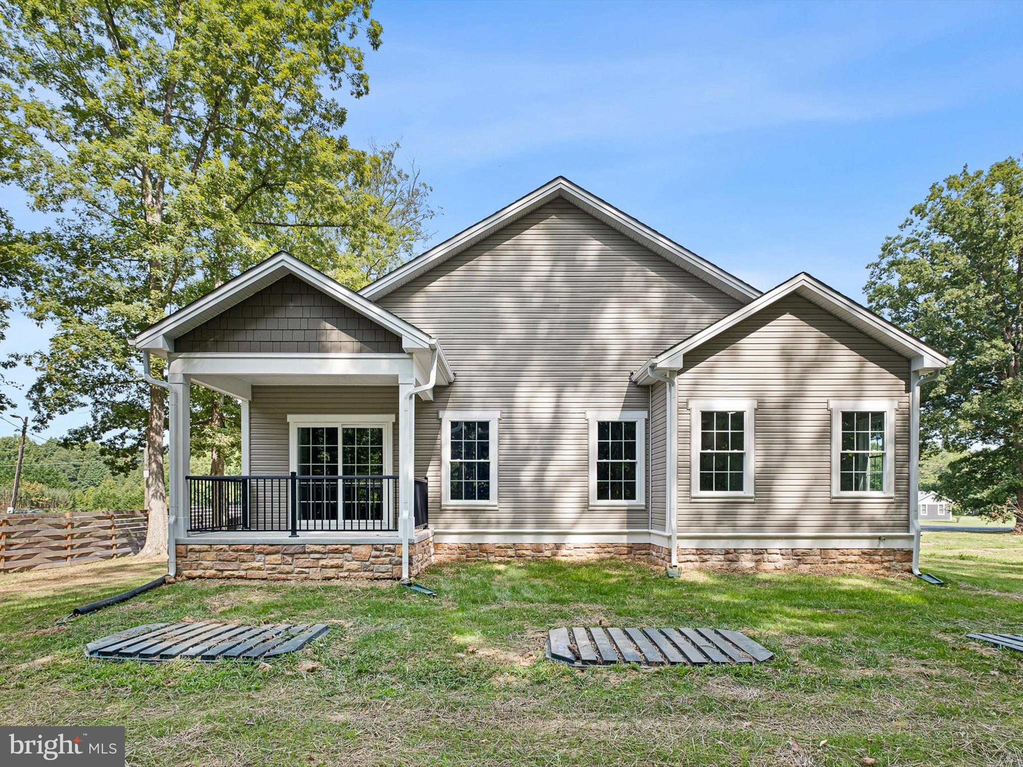 154 Pine Tree Road Townsend, DE 19734 - Photo 31 of 33 a view of a yard in front of a house with large windows