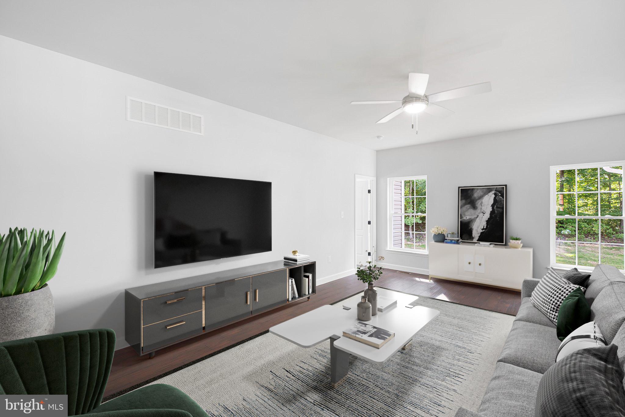154 Pine Tree Road Townsend, DE 19734 - Photo 6 of 33 a living room with furniture and a flat screen tv