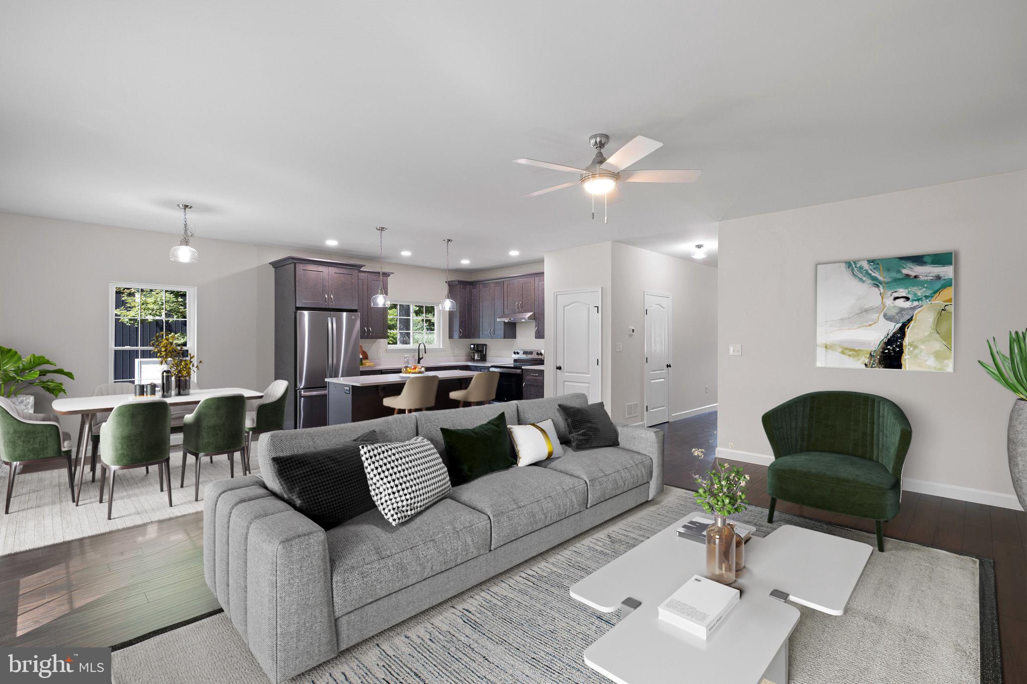 154 Pine Tree Road Townsend, DE 19734 - Photo 8 of 33 a living room with furniture kitchen view and a chandelier