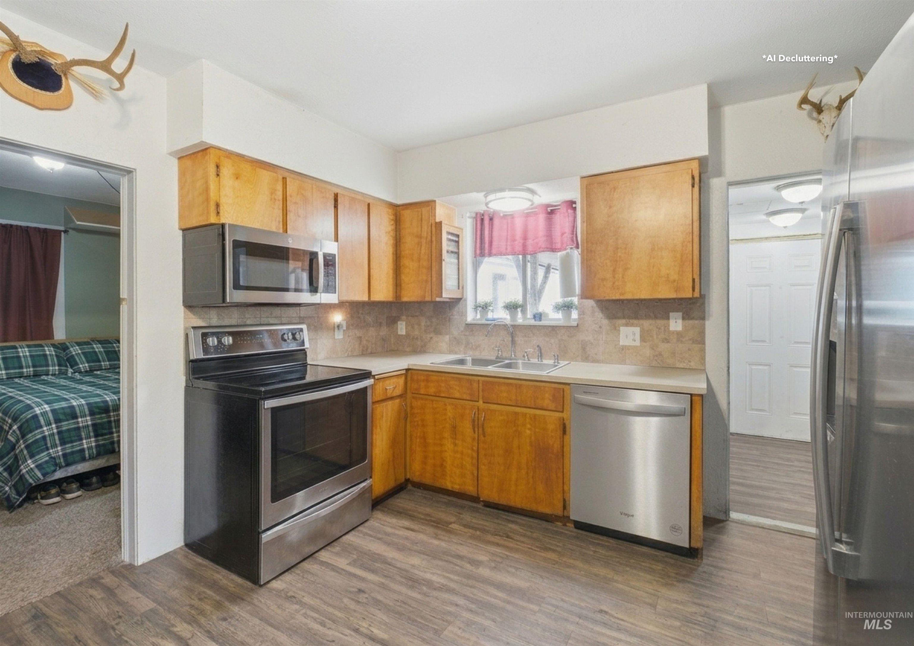 735 Oak Street Potlatch, ID 83855 - Photo 7 of 30 Kitchen featuring wood-finish flooring and light wood cabinetry