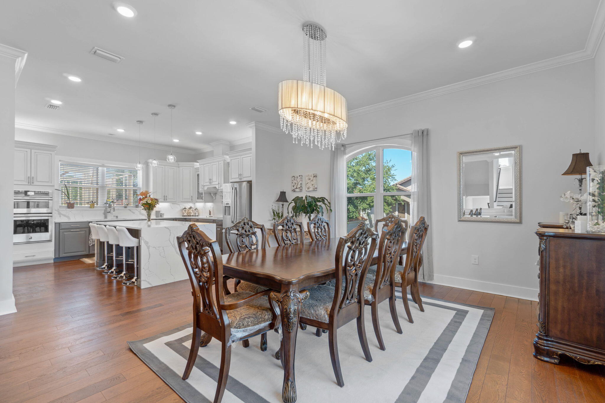 234 Inverrary Drive Destin, FL 32541 - Photo 13 of 53 a view of a dining room with furniture window and wooden floor