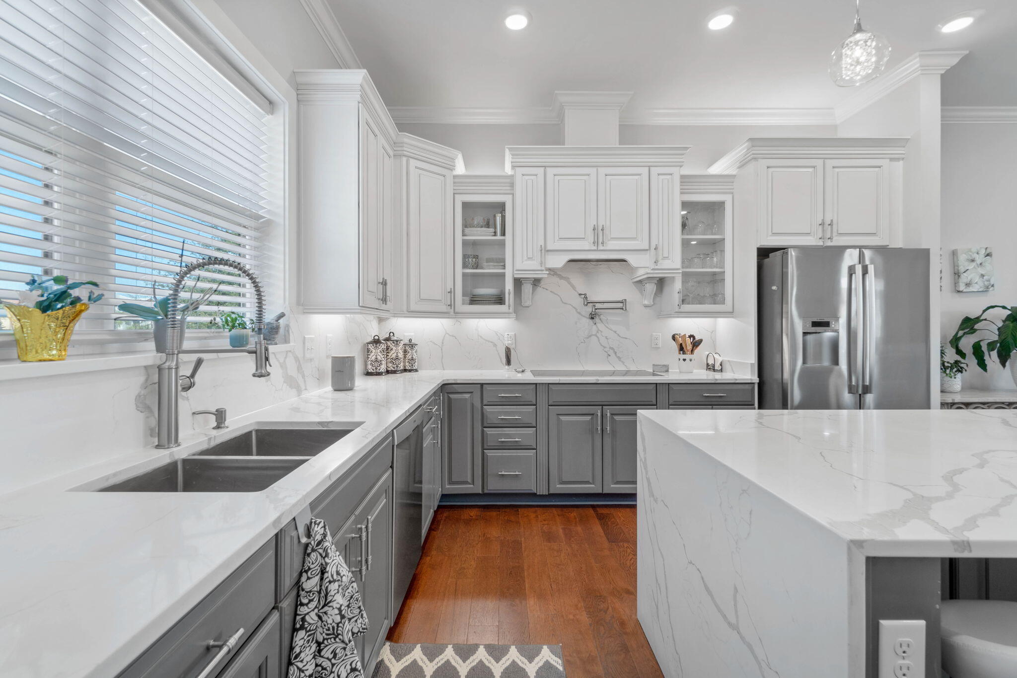 234 Inverrary Drive Destin, FL 32541 - Photo 17 of 53 a large kitchen with stainless steel appliances kitchen island granite countertop a sink and cabinets