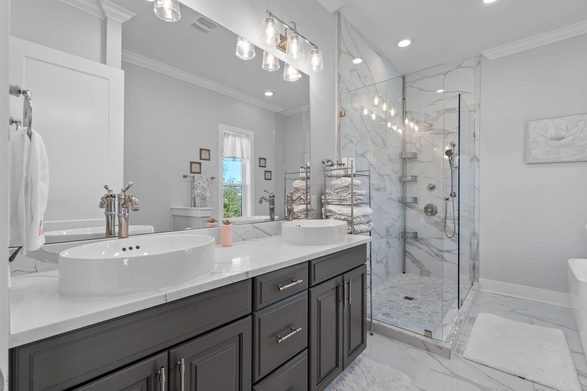 234 Inverrary Drive Destin, FL 32541 - Photo 28 of 53 a bathroom with a shower sink double and mirror