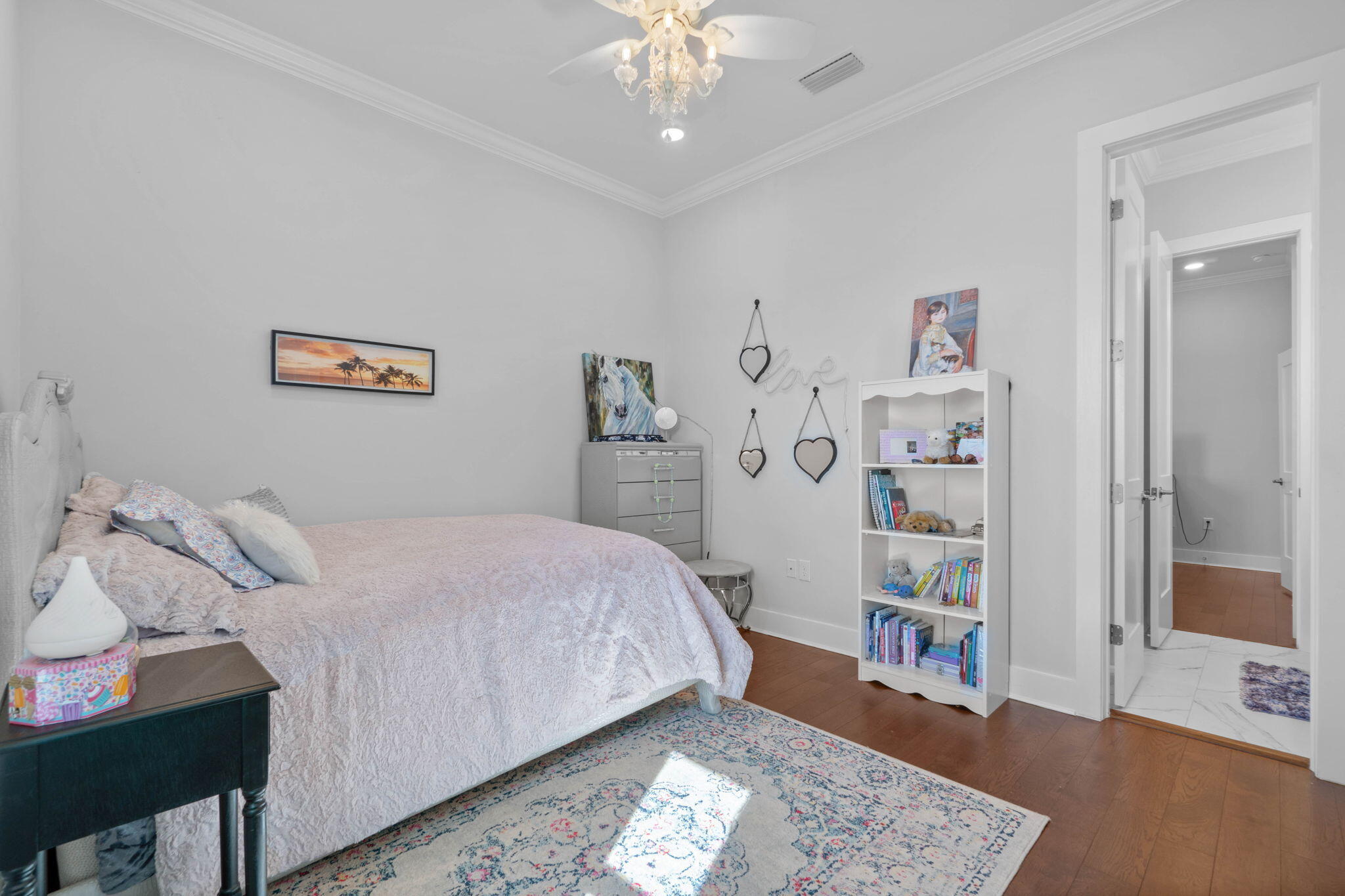 234 Inverrary Drive Destin, FL 32541 - Photo 35 of 53 a bedroom with a bed and a chandelier