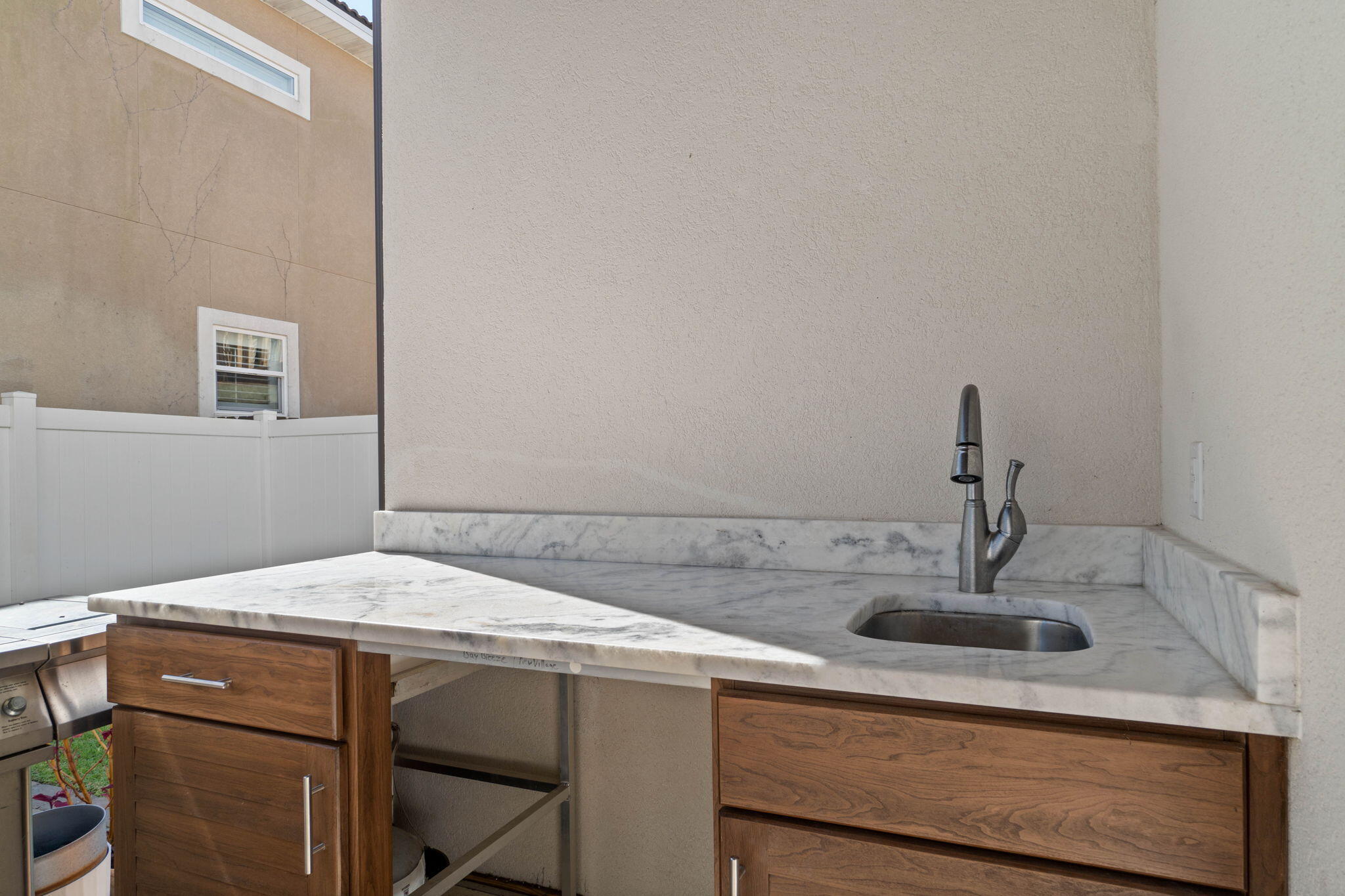 234 Inverrary Drive Destin, FL 32541 - Photo 45 of 53 a bathroom with a sink and cabinets