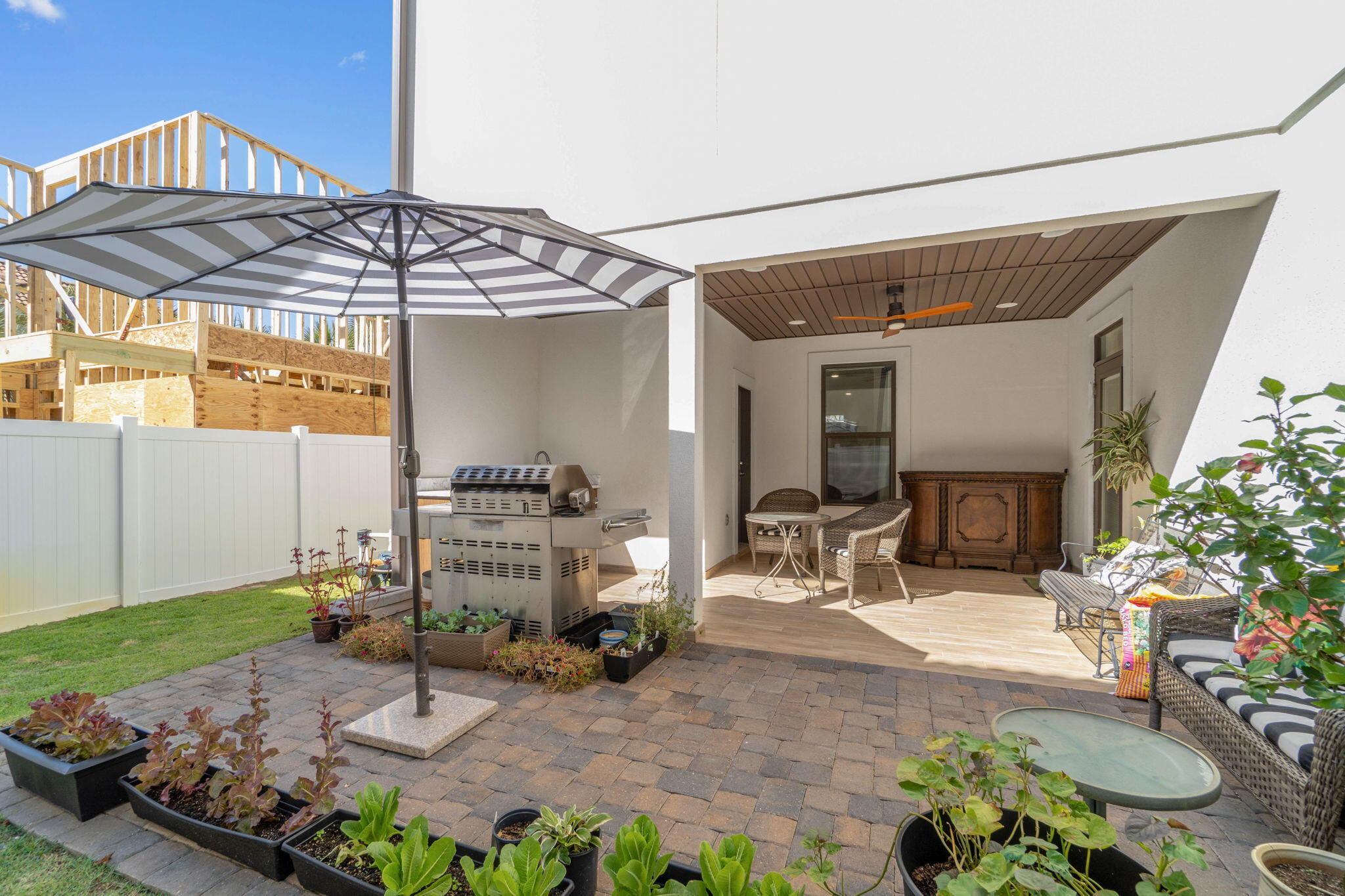 234 Inverrary Drive Destin, FL 32541 - Photo 46 of 53 a backyard of a house with yard and outdoor seating