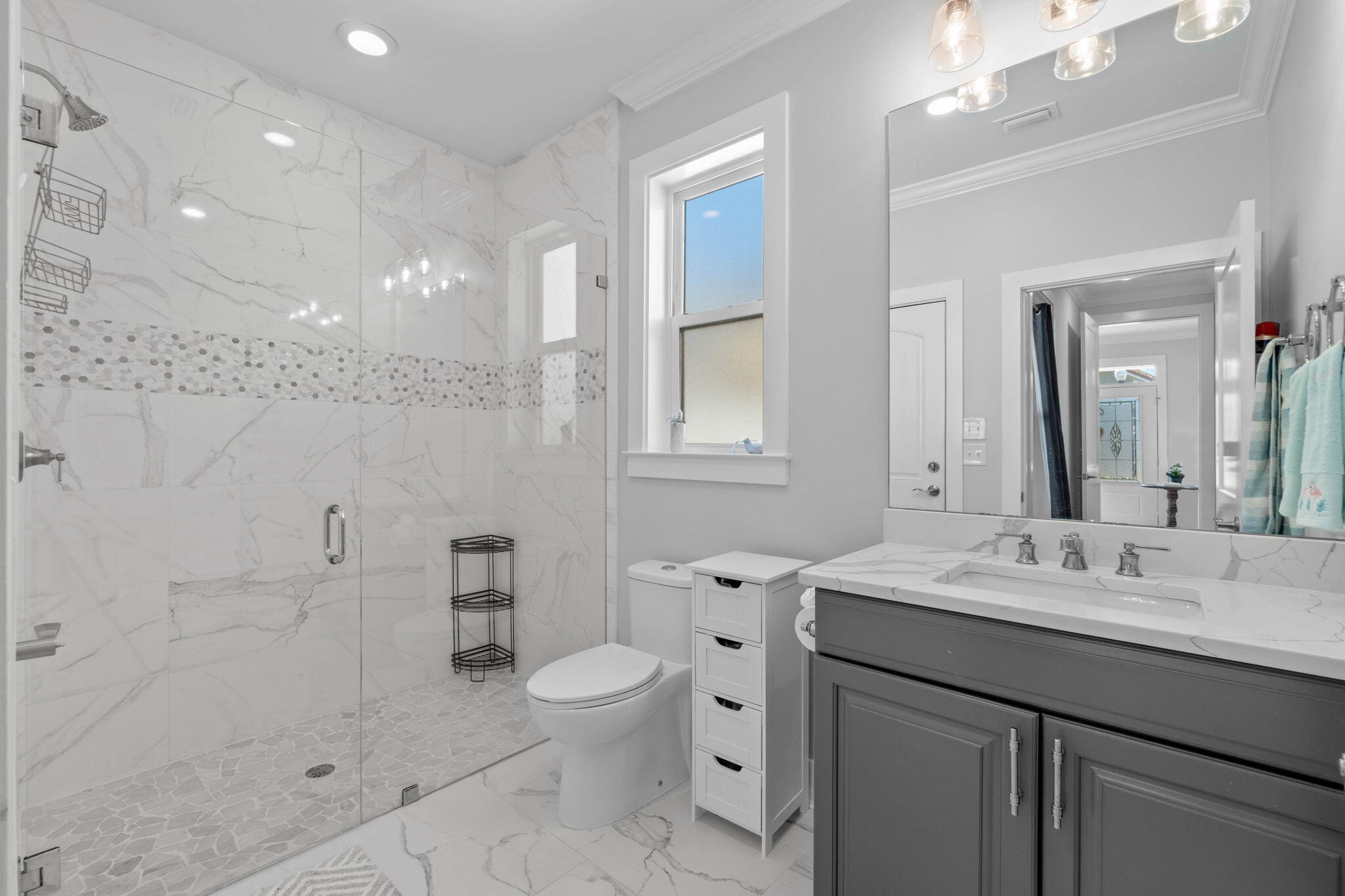 234 Inverrary Drive Destin, FL 32541 - Photo 7 of 53 a bathroom with a sink a toilet and shower