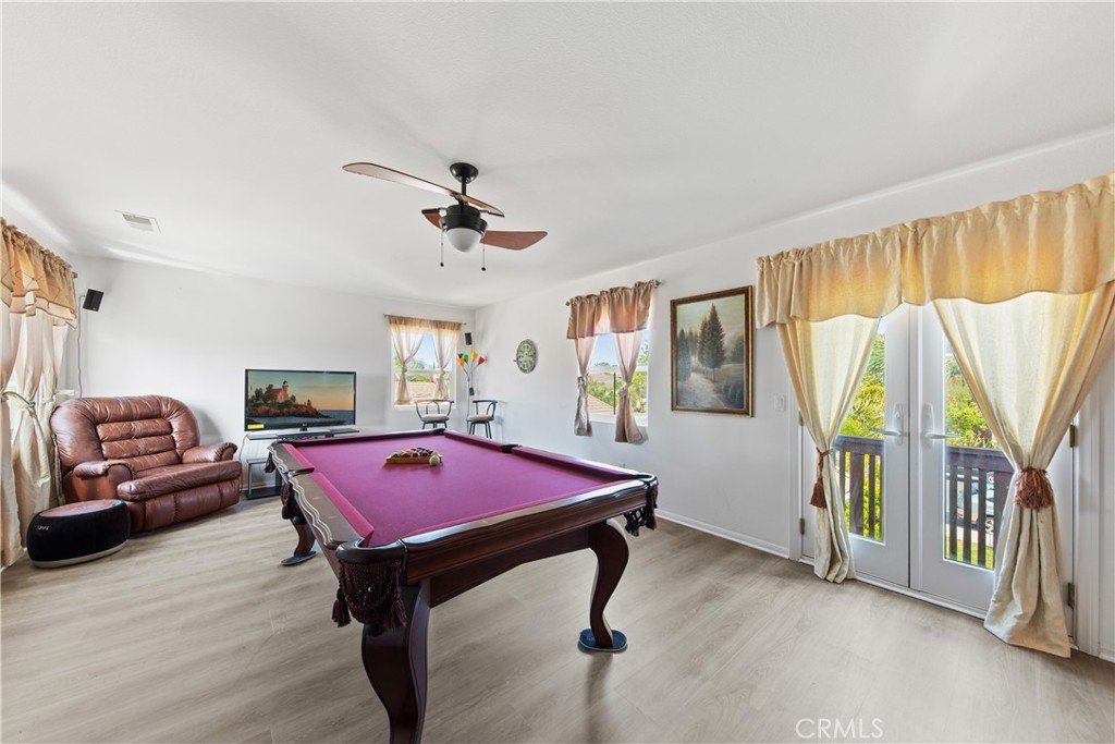 34138 Amici Street Temecula, CA 92592 - Photo 12 of 45 a room with furniture and a window