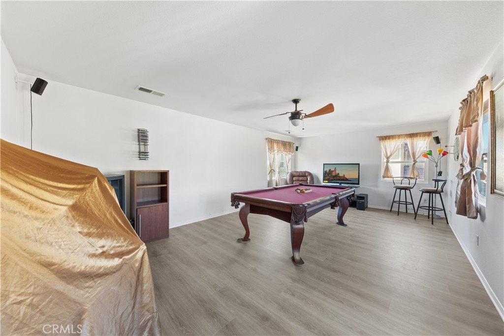 34138 Amici Street Temecula, CA 92592 - Photo 13 of 45 a living room with furniture and a wooden floor
