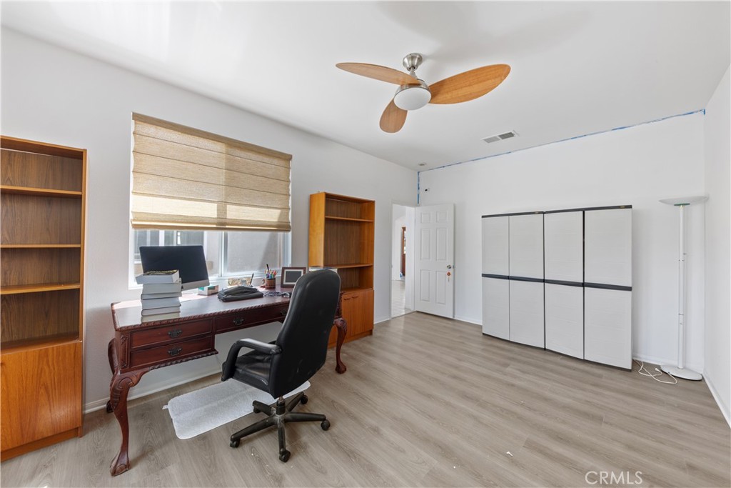34138 Amici Street Temecula, CA 92592 - Photo 14 of 45 a view of a workspace with furniture and a window
