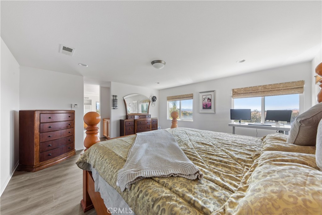 34138 Amici Street Temecula, CA 92592 - Photo 19 of 45 a bed room with a bed and furniture