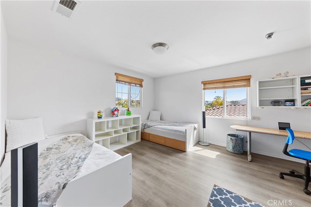 34138 Amici Street Temecula, CA 92592 - Photo 25 of 45 a living room with furniture and a wooden floor