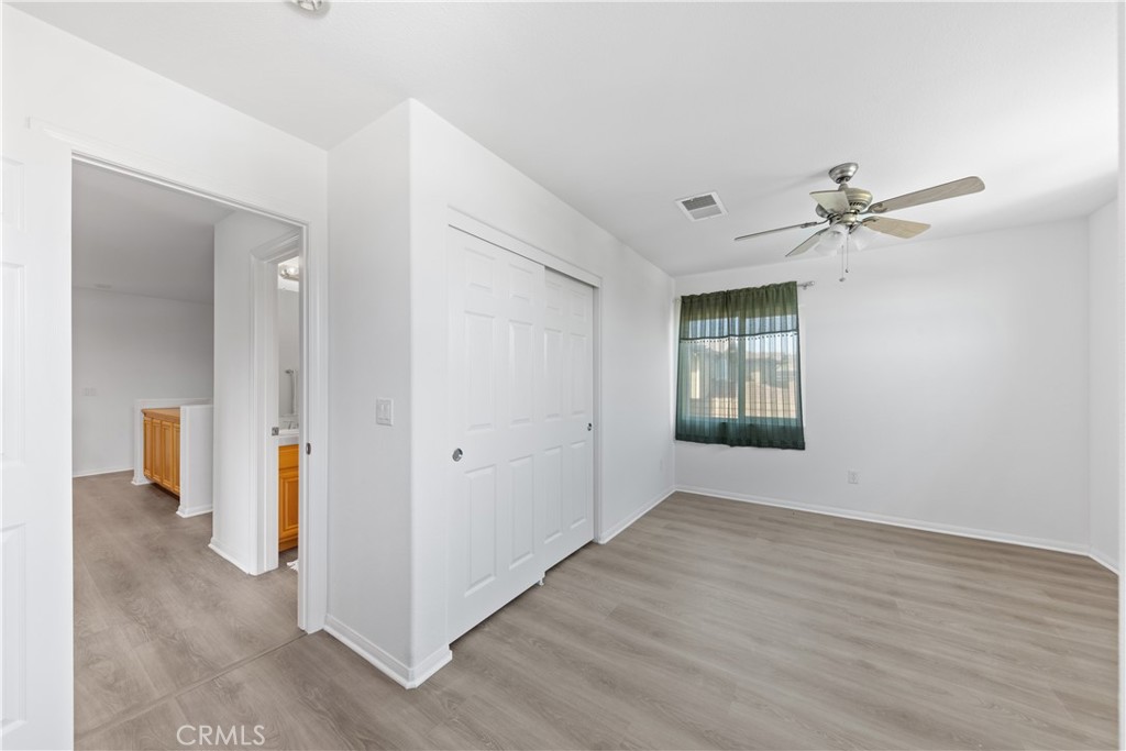 34138 Amici Street Temecula, CA 92592 - Photo 27 of 45 wooden floor in an empty room with a window