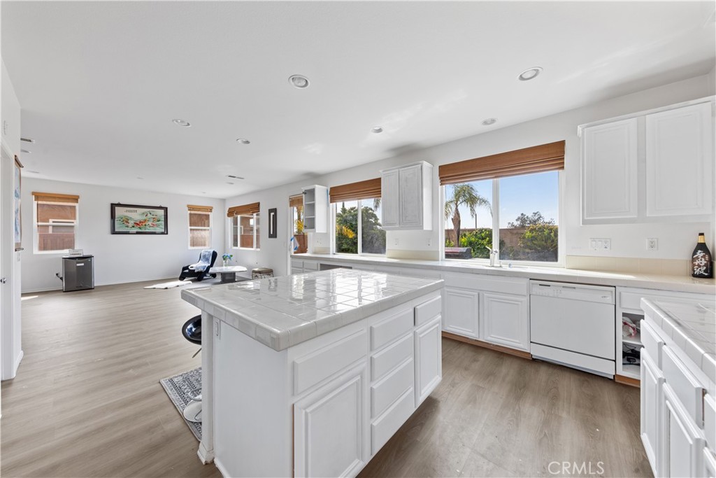 34138 Amici Street Temecula, CA 92592 - Photo 3 of 45 a kitchen with sink stove and cabinets
