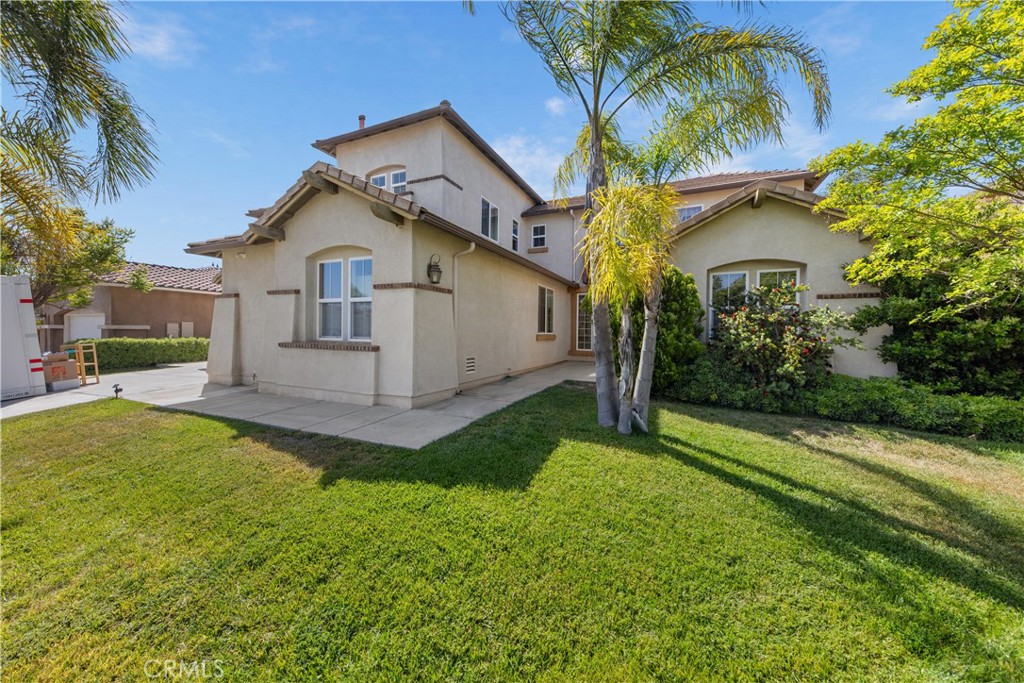 34138 Amici Street Temecula, CA 92592 - Photo 36 of 45 a front view of house with yard and green space
