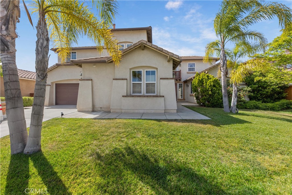 34138 Amici Street Temecula, CA 92592 - Photo 37 of 45 a front view of house with yard and trees in the background