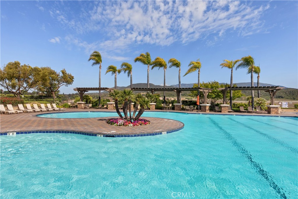 34138 Amici Street Temecula, CA 92592 - Photo 38 of 45 a swimming pool with outdoor seating and yard