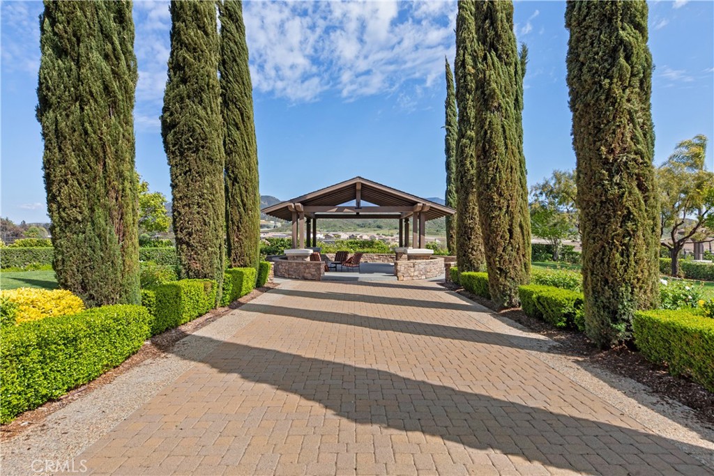 34138 Amici Street Temecula, CA 92592 - Photo 40 of 45 a view of house with a yard and potted plants