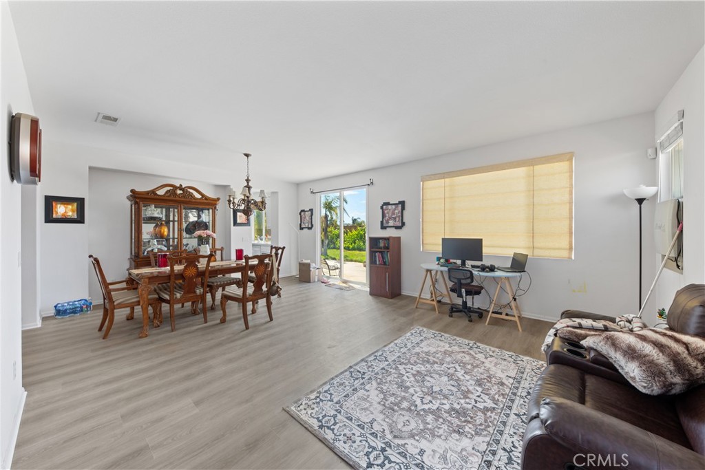 34138 Amici Street Temecula, CA 92592 - Photo 4 of 45 a living room with furniture and a large window