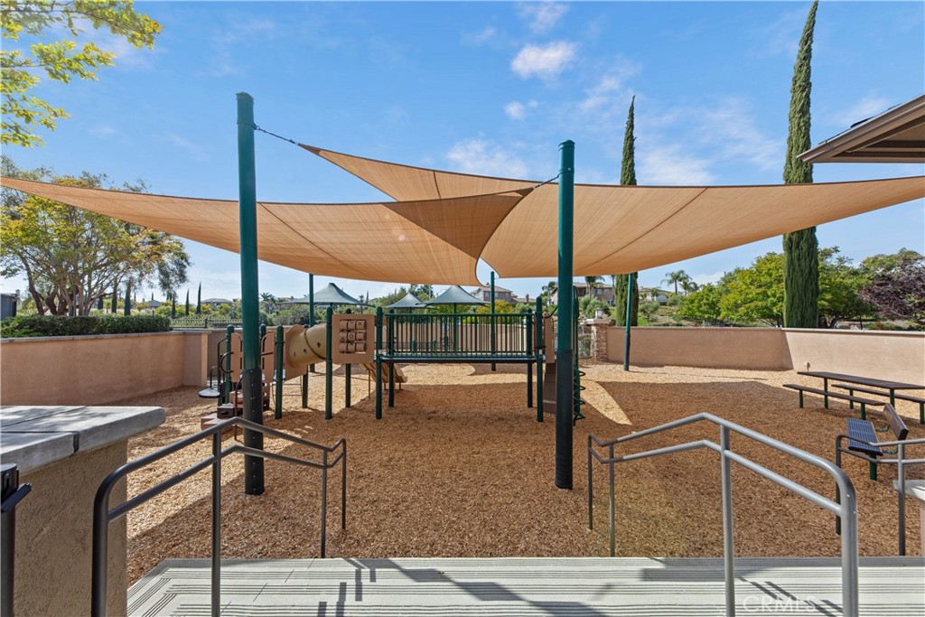 34138 Amici Street Temecula, CA 92592 - Photo 41 of 45 a view of a patio with a table and chairs