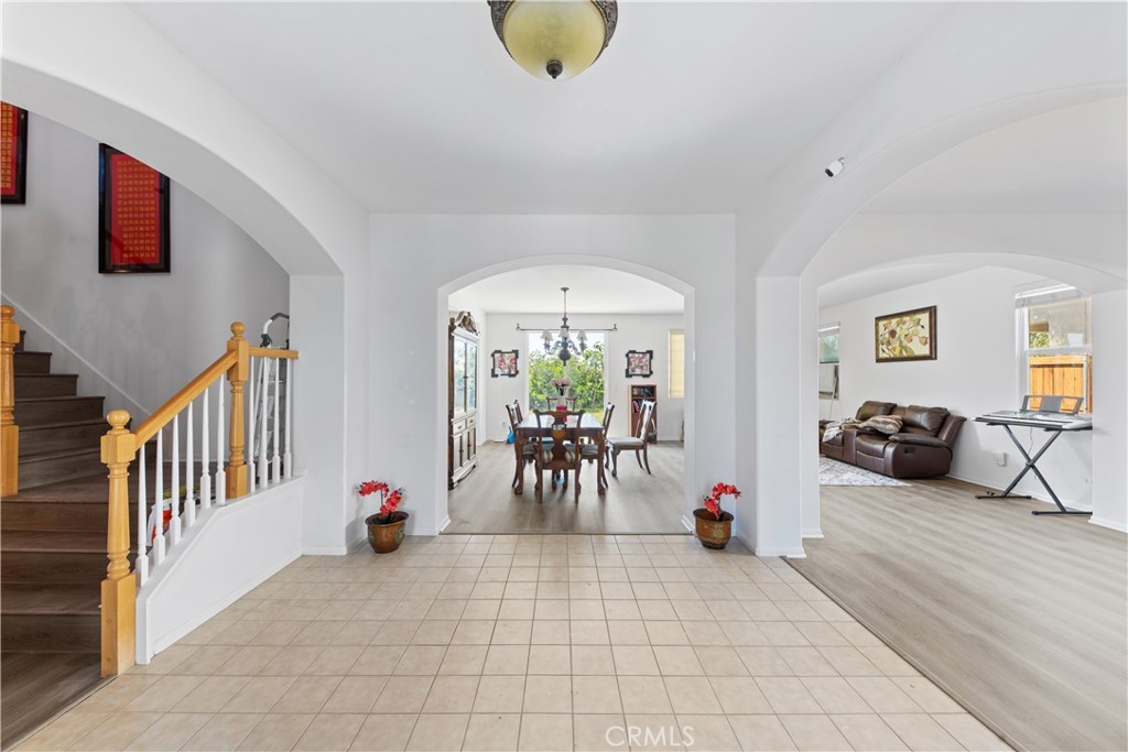 34138 Amici Street Temecula, CA 92592 - Photo 8 of 45 a living room with furniture and a chandelier