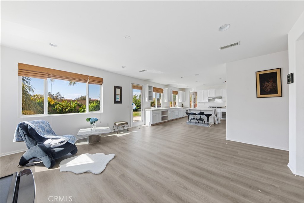 34138 Amici Street Temecula, CA 92592 - Photo 9 of 45 a living room with furniture and a large window