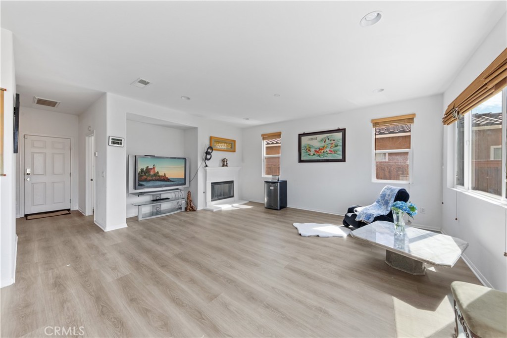 34138 Amici Street Temecula, CA 92592 - Photo 10 of 45 a living room with furniture and a flat screen tv
