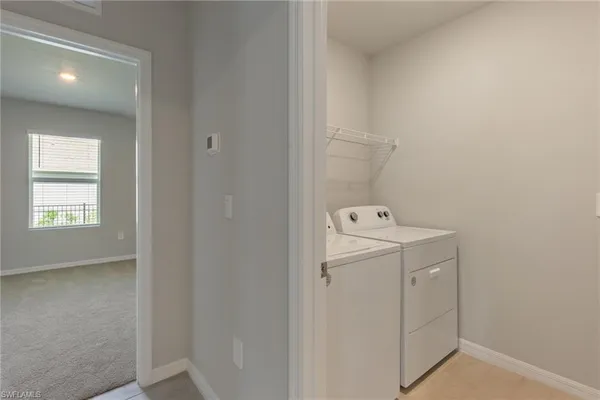 a utility room with dryer and washer