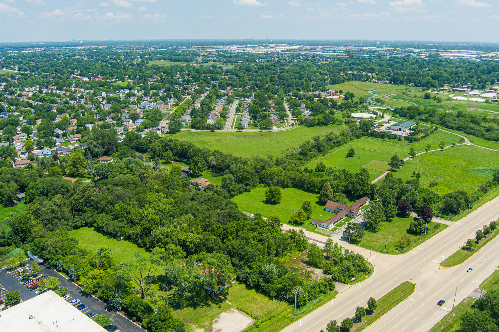 27-w046 North Avenue Carol Stream, IL 60188 - Photo 12 of 16 an aerial view of residential houses with outdoor space and trees