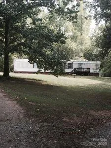a view of a yard with car parked