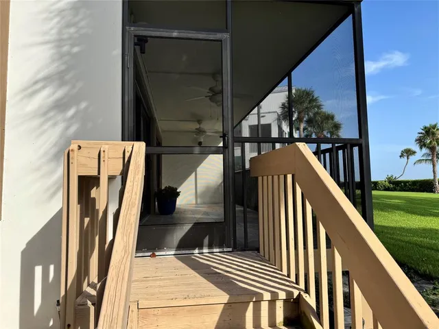 a view of balcony with furniture