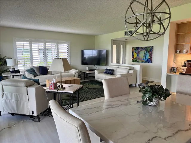 a work room with furniture and a flat screen tv