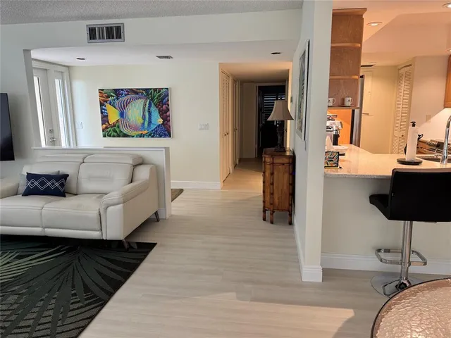 a living room with furniture and a rug