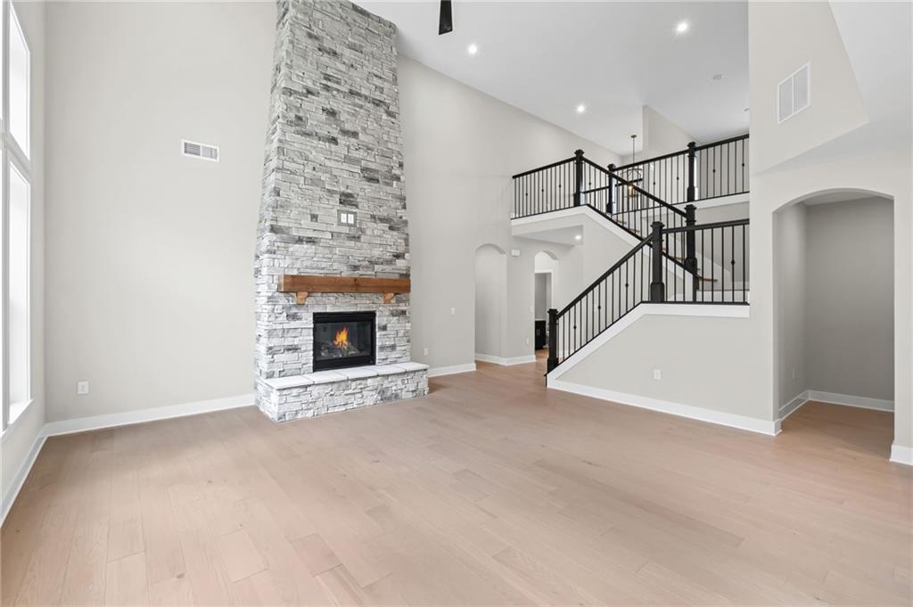714 Conley Drive Canton, GA 30115 - Photo 11 of 51 a view of an empty room with fireplace and stairs
