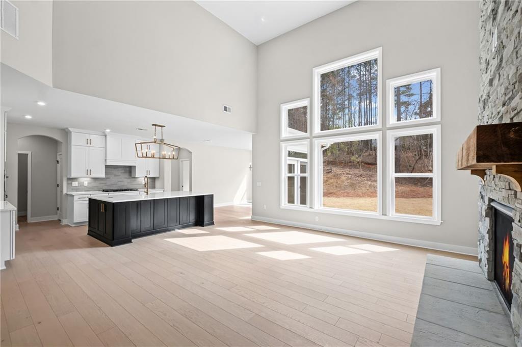 714 Conley Drive Canton, GA 30115 - Photo 12 of 51 a living room with fireplace furniture and a flat screen tv