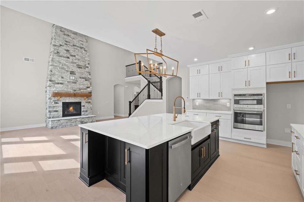 714 Conley Drive Canton, GA 30115 - Photo 17 of 51 a kitchen with a sink a stove and a refrigerator