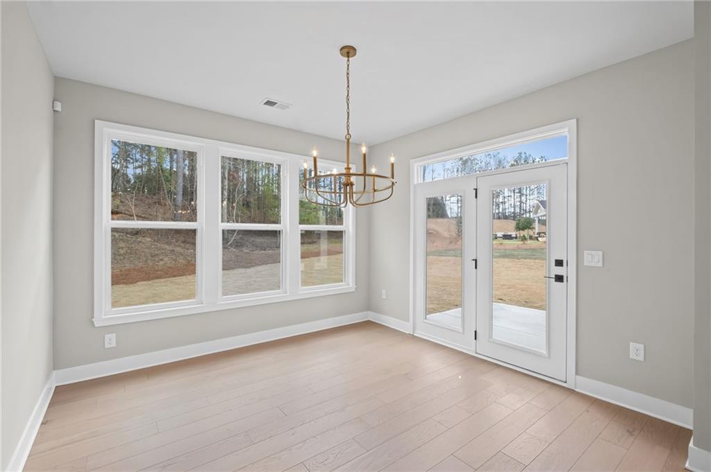714 Conley Drive Canton, GA 30115 - Photo 20 of 51 an empty room with windows and outdoor view